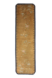Antique Chinese Art Deco Walter Nichols runner rug, 152x43 inches, featuring graceful cranes and delicate floral sprays on a golden background with navy crenellated borders.